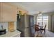 Cozy kitchen featuring stainless steel refrigerator and adjacent breakfast nook with seating for four at 691 Anne Ln # 0, Henderson, NV 89015