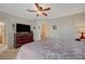 Bright and airy main bedroom features a ceiling fan and an adjacent bathroom with a shower at 691 Anne Ln # 0, Henderson, NV 89015