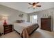 This primary bedroom features a ceiling fan and access to a balcony at 691 Anne Ln # 0, Henderson, NV 89015