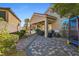 A paver patio leads to a covered outdoor seating area at 746 Royal Course Ct, Las Vegas, NV 89148