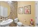 Stylish half-bathroom with mosaic tile accent wall and modern fixtures at 746 Royal Course Ct, Las Vegas, NV 89148