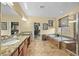 Bathroom featuring a soaking tub, step-in shower, and dual sink vanity at 746 Royal Course Ct, Las Vegas, NV 89148