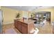 Kitchen island with granite countertops and seating, opens up to the dining area and Gathering room at 746 Royal Course Ct, Las Vegas, NV 89148