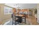 Bright kitchen features stainless appliances, wood cabinets, tile backsplash, and a dining table set at 746 Royal Course Ct, Las Vegas, NV 89148