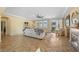 Bright living room with tile floors, ceiling fan, fireplace, and access to the outdoor space at 746 Royal Course Ct, Las Vegas, NV 89148