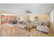 Open concept living room flows into the kitchen with a sectional sofa at 746 Royal Course Ct, Las Vegas, NV 89148