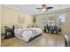 Inviting main bedroom with a ceiling fan, tiled floor and bright natural light at 746 Royal Course Ct, Las Vegas, NV 89148