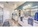 This bathroom features a double vanity, granite countertops, custom mirrors and a glass enclosed shower at 7808 Alola Springs Ln # Lot 2, North Las Vegas, NV 89084