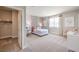 Bright bedroom with closet, a comfy bed, and a desk for a student at 7812 Alola Springs Ln # Lot 1, North Las Vegas, NV 89084