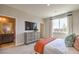 Serene bedroom with a wall-mounted television and a view of the connected bathroom at 7812 Alola Springs Ln # Lot 1, North Las Vegas, NV 89084