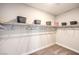 Functional walk-in closet offering carpeted floors, white walls, and well-organized shelving for accessories at 7812 Alola Springs Ln # Lot 1, North Las Vegas, NV 89084