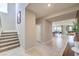 Hallway leading to the combined kitchen, dining and living room. Staircase on left leads to second floor at 7812 Alola Springs Ln # Lot 1, North Las Vegas, NV 89084