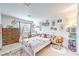 bedroom with playful decor, dresser, teepee and white walls at 7848 Desert Bell Ave, Las Vegas, NV 89128