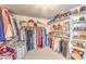 Large walk-in closet with shelving and clothing racks for optimal storage at 7848 Desert Bell Ave, Las Vegas, NV 89128