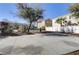 A basketball court with a hoop and backboard is featured in a residential neighborhood at 8235 Misty Sage St, Las Vegas, NV 89139