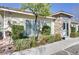 Exterior of a community clubhouse with a stone facade and well-maintained landscaping at 8235 Misty Sage St, Las Vegas, NV 89139