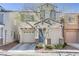 Inviting two-story home showcasing a one car garage, covered entryway, and manicured front yard at 8235 Misty Sage St, Las Vegas, NV 89139