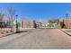 Gated entrance of a community with brick pillars and manicured landscaping at 8235 Misty Sage St, Las Vegas, NV 89139