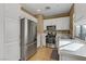 Well-lit kitchen featuring stainless steel appliances, white cabinetry, and plenty of counter space at 8235 Misty Sage St, Las Vegas, NV 89139