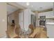 Bright kitchen with stainless steel appliances and a glass table seating set for cozy dining at 8235 Misty Sage St, Las Vegas, NV 89139