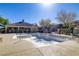 A community pool is showcased with clear blue skies and an adjacent pool house at 8235 Misty Sage St, Las Vegas, NV 89139