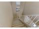 Carpeted staircase with white railing leads to the upper level of the home at 8235 Misty Sage St, Las Vegas, NV 89139