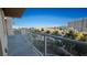 Enjoy stunning views from this spacious balcony with glass railings overlooking lush landscaping and city views at 8255 Las Vegas Blvd # 415, Las Vegas, NV 89123