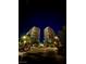 Night view of two high-rise residential towers with palm trees and parking area at 8255 Las Vegas Blvd # 415, Las Vegas, NV 89123