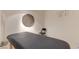 Massage room with a padded table, chair, and modern decor for relaxation at 8255 Las Vegas Blvd # 415, Las Vegas, NV 89123