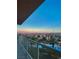 Balcony view showcasing a picturesque sunset, palm trees, and a sparkling pool at 8255 Las Vegas Blvd # 415, Las Vegas, NV 89123