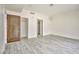 Bright bedroom featuring wood-look flooring, closet, and minimalist design at 8925 W Flamingo Rd # 110, Las Vegas, NV 89147