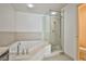 A luxurious bathroom featuring a soaking tub and a glass-enclosed shower at 8925 W Flamingo Rd # 110, Las Vegas, NV 89147