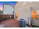 A brick-paved back patio features an air conditioning unit, brick wall, outdoor grill, and view of the home at 9151 Mount Wilson St, Las Vegas, NV 89113