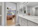 Bright bathroom featuring a double sink vanity and a peek into the bedroom at 9151 Mount Wilson St, Las Vegas, NV 89113