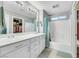 Well-lit bathroom with double sinks, shower-tub combination, and modern fixtures at 9151 Mount Wilson St, Las Vegas, NV 89113