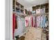 Organized walk-in closet with ample shelving, hanging space, and storage boxes at 9151 Mount Wilson St, Las Vegas, NV 89113