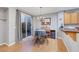 Bright view of dining area with glass doors to patio, and a view of stainless steel appliances at 9151 Mount Wilson St, Las Vegas, NV 89113