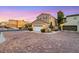 Charming home featuring a two-car garage, manicured landscaping, and a brick driveway at 9151 Mount Wilson St, Las Vegas, NV 89113