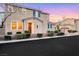 Inviting two-story home with blue shutters and manicured front yard landscaping at 9151 Mount Wilson St, Las Vegas, NV 89113