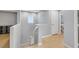 Hallway with staircase leading to the upper level, showcasing neutral tones and natural lighting at 9151 Mount Wilson St, Las Vegas, NV 89113