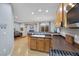 A kitchen featuring stainless steel appliances, wooden cabinets, and an island sink at 9151 Mount Wilson St, Las Vegas, NV 89113