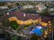 Aerial view of estate shows a sprawling backyard with pool, covered patio and pristine landscaping at 9825 Glenrock Dr, Las Vegas, NV 89134