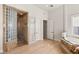 Spacious bathroom featuring a glass block shower, storage cabinet, and luxurious soaking tub at 9825 Glenrock Dr, Las Vegas, NV 89134