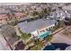 Stunning aerial view of the house showcasing the backyard oasis with a pool, spa, and lush landscaping in a tranquil neighborhood at , Las Vegas, NV 89149