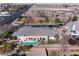 Aerial view of the property shows lush landscaping, pool, patio, and desirable neighborhood at , Las Vegas, NV 89149