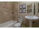 The bathroom features custom tile work, framed art, and stylish fixtures at , Las Vegas, NV 89149