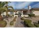 Charming front exterior featuring desert landscaping, stone accents, and a welcoming entryway at , Las Vegas, NV 89149