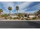 A front view shows desert landscaping and mature palm trees at , Las Vegas, NV 89149