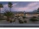 Stunning single-story home featuring meticulously landscaped yard, complemented by mature palm trees at , Las Vegas, NV 89149