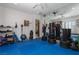 A home gym boasts large mirrors, ample floor space, and ample equipment at 4830 Byzantine Ct, Las Vegas, NV 89149